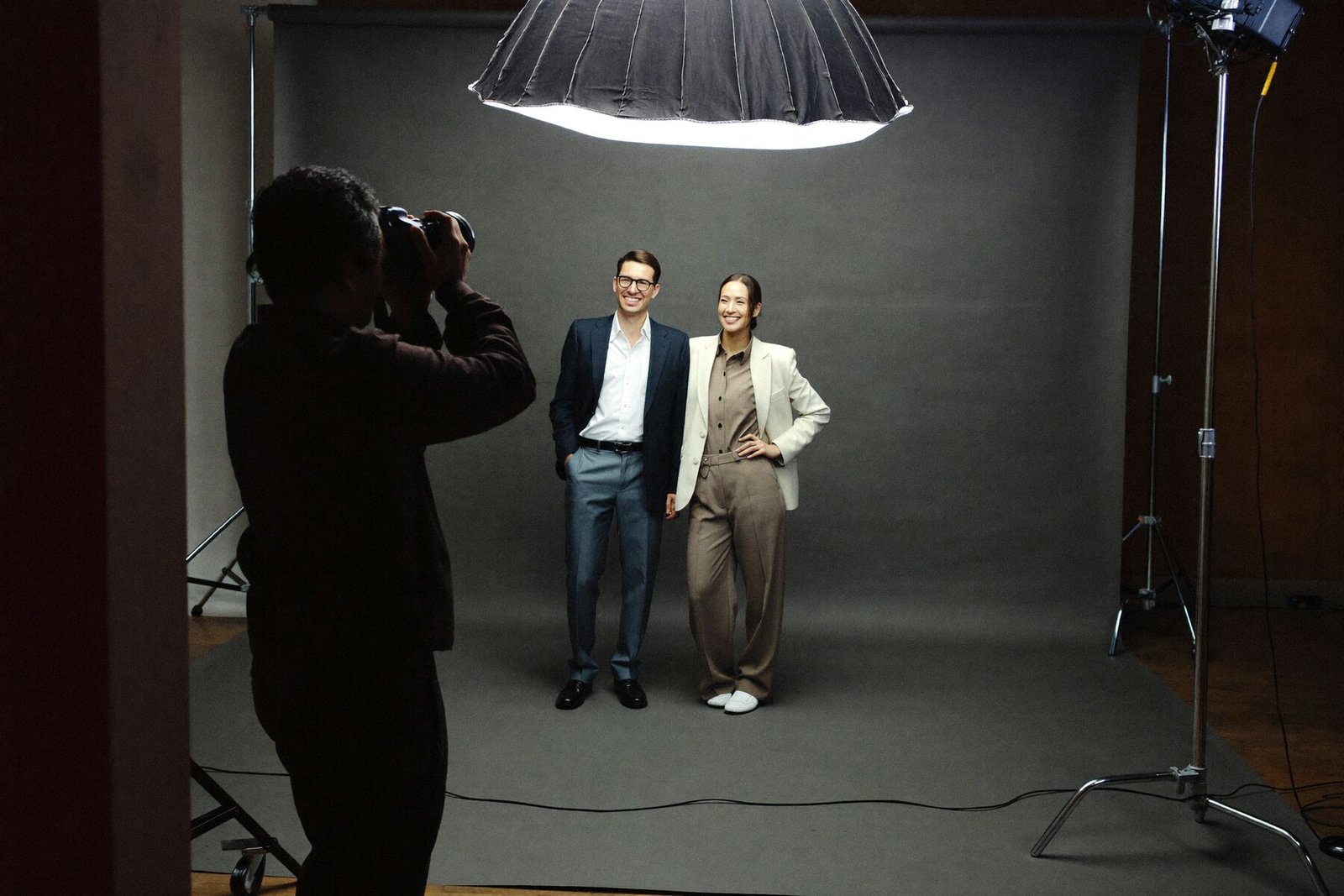 Behind the scenes of a PIX ART shoot with two business partners under studio lights